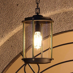 A unique Vintage Outdoor Pendant, 15-7/8"H x 9-3/4"W, hanging from an archway.