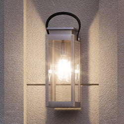 A beautiful UHP1131 Modern Farmhouse Outdoor Wall Light, 19-3/8"H x 7-7/8"W, Stainless Steel Finish lighting fixture on a wall.