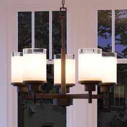A beautiful UHP2018 Contemporary Chandelier, 19.75"H x 20"W, with four lights hanging in front of a window.