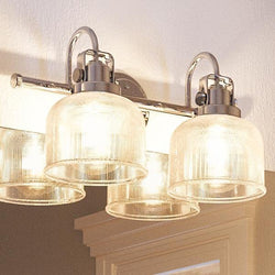 Three Urban Ambiance UHP2040 Industrial Chic Bath Fixtures, 8-3/4"H x 17"W, Polished Chrome Finish from the Harlow Collection hanging over a bathroom mirror