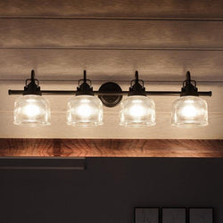 An UHP2047 Industrial Chic Bath Fixture with four unique glass shades, from the Harlowe Collection of Urban Ambiance.