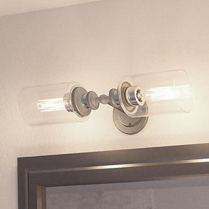 A unique bathroom with two UHP2061 Industrial Chic Chic Bathroom Vanity Lights, 4.75"H x 18.5"W, Aged Nickel Finish, Lincoln Collection by Urban Amb