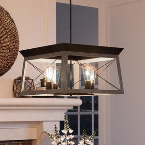A beautiful UHP2122 Industrial Chic Chandelier, 12"H x 20"W, Olde Bronze Finish, Berkeley Collection by Urban Ambiance hanging over a fireplace in a living room