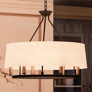 A unique UHP2183 Cosmopolitan Chandelier, 22.375"H x 24"W, Olde Bronze Finish, Marsala Collection by Urban Ambiance hanging over a dining room table