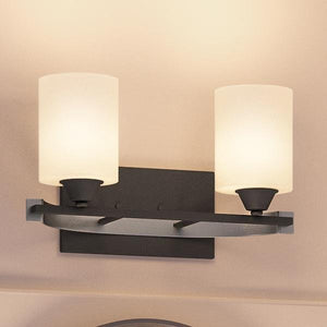 A beautiful bathroom with two unique UHP2230 Mid-Century Modern Modern Bathroom Vanity Lights, 7.875"H x 14.25"W, Charcoal Finish, Tampa Collection by Urban
