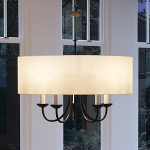 An Urban Ambiance UHP2281 Transitional Chandelier, a stunning lighting fixture with a white shade, positioned in front of a window.