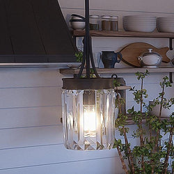A beautiful pendant lamp hanging over a kitchen counter.