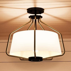 A gorgeous Urban Ambiance ceiling lamp with a white shade.
