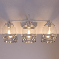Three beautiful UHP2538 Industrial Chic Bathroom Vanity Lights, 11.25"H x 26"W, Polished Nickel Finish, Nottingham Collection by Urban Ambiance hanging on a wall in a bathroom