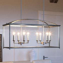 A beautiful Moroccan chandelier, 16.5"H x 30.125"W, hanging over a dining room table.