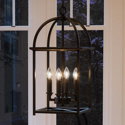 A unique and beautiful Urban Ambiance UHP2654 Moroccan Hall & Foyer lighting fixture hanging over a window in a living room.