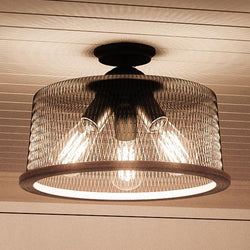 A beautiful Urban Ambiance vintage lighting fixture, featuring a luxurious Olde Bronze finish and part of the Eugene Collection, with a light bulb centrally positioned.