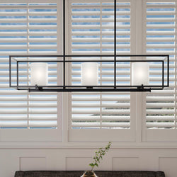 A beautiful dining room with the unique UHP3131 Minimalist Chandelier, 8.75"H x 40"W, Midnight Black Finish, Kennewick Collection hanging over a window from Urban