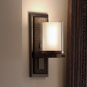 An Urban Ambiance UHP3161 Contemporary Wall Lights, 13"H x 5"W, Olde Bronze Finish, Evanston Collection with a beautiful light on it.