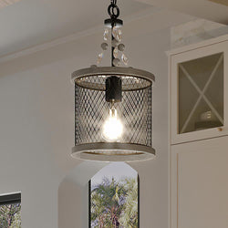 An Urban Ambiance UHP3381 Provincial Pendant Light, 15.625"H x 8.5"W, Olde Bronze Finish, Layton Collection lighting fixture hanging over a window