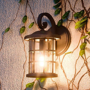 A unique UQL1042 Craftsman Outdoor Wall Light with ivy growing on it, from the Vienna Collection by Urban Ambiance.