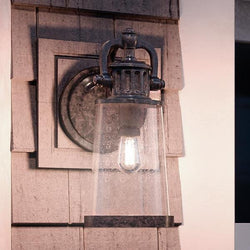 An Urban Ambiance UQL1222 Vintage Outdoor Wall Light, a gorgeous lighting fixture from the Geneva Collection, featuring a Royal Bronze Finish and glass shade.