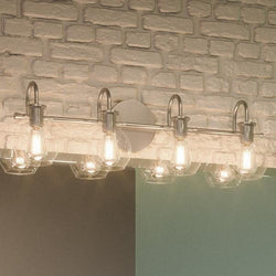 An Urban Ambiance bathroom with a UQL2042 Vintage Bathroom Light, 9"H x 30.5"W, Aged Nickel Finish from the Venice Collection and luxury lighting fixture.