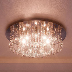 A beautiful Urban Ambiance ceiling light with crystals hanging from it, the UQL2081 Crystal Flush Mount Ceiling Light, 9"H x 19.75"W, Chrome Finish, Manhattan