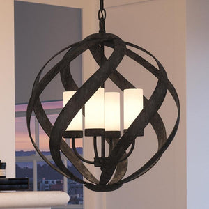 A beautiful lighting fixture, the UQL2781 Rustic Chandelier from the Walsall Collection by Urban Ambiance is hanging over a fireplace.