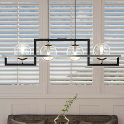A living room with a unique UQL3241 Minimalist Chandelier, 10.5"H x 40"W, Natural Black Finish, Odessa Collection from Urban Ambiance.