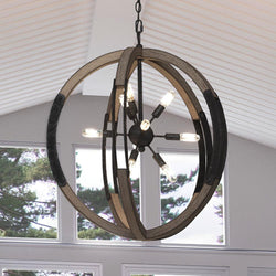 An Urban Ambiance beautiful circular lamp hanging over a window in a living room.