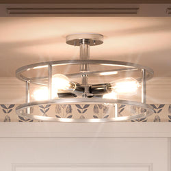 A beautiful Scandinavian ceiling lamp with a circular pattern on the ceiling.