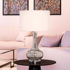A living room with a pink couch and a unique UEX7060 French-Country Table Lamp 16''W x 16''D x 28''H, Antique Mercury Finish,