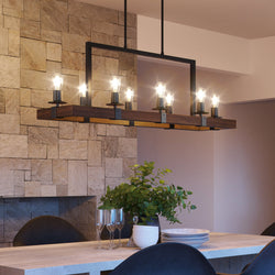 A dining room with a unique and gorgeous UFS2011 Modern Farmhouse Chandelier, 15''H x 44''W, Matte Black & Rich Walnut Finish, Broadway Collection