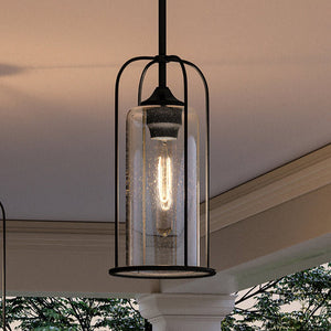 Two UHP1303 Farmhouse Outdoor Pendant lamps hanging over a porch from Urban Ambiance brand.
