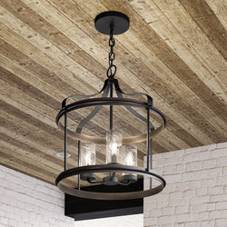 A unique UHP1421 Farmhouse Outdoor Pendant hanging from a brick wall.