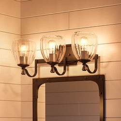 A luxurious bathroom featuring a UHP2033 Crystal Bathroom Vanity Light and Ravenna Collection mirror, both exuding unique beauty.