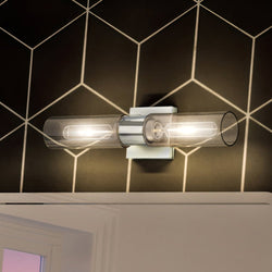 A luxurious bathroom with the Urban Ambiance UHP4052 Cosmopolitan Bath Light 5''H x 20.375''W, Polished Chrome Finish, Tustin Collection tiled wall.