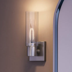 A UHP4054 Cosmopolitan Wall Sconce with a glass bulb, creating a luxurious and gorgeous ambiance.
