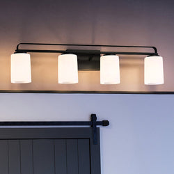 A beautiful bathroom with a black door and a UHP4115 Modern Bath Light 7.625''H x 32.5''W, Midnight Black Finish, Broome Collection from Urban Amb