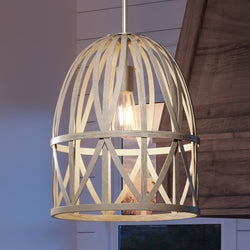 A beautiful pendant lamp with a farmhouse style cage hanging from it.