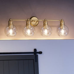 A beautiful bathroom with a UHP4173 Vintage Bath Light in Olde Brass Finish from Urban Ambiance.