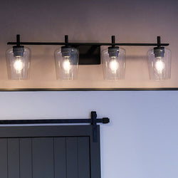 A beautiful bathroom with a UHP4211 New Traditional Bath Light 8.5''H x 34''W, Midnight Black Finish from the Swan-Hill Collection by Urban Ambiance.