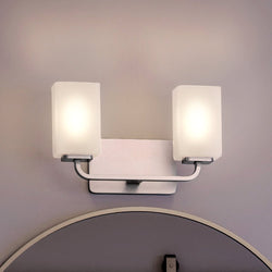 An Urban Ambiance UHP4321 Contemporary Bath Light 8.5''H x 13.5''W with a gorgeous Brushed Nickel Finish, Louisville Collection bathroom with a mirror.