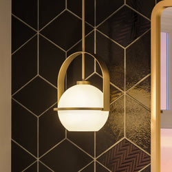 A unique black and white tiled bathroom with a Urban Ambiance UHP4342 Mid-Century Modern Pendant 12.375''H x 9.375''W, Brushed