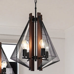 Three unique ULB2311 Transitional Pendant light fixtures hanging from a ceiling in a room.