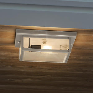 A gorgeous UQL1635 Modern Farmhouse Outdoor Ceiling lighting fixture with a luxury stainless steel finish, part of the Quincy Collection, featuring a glass shade.