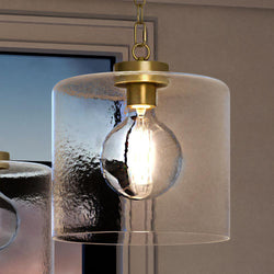 Two UQL3790 Modern Farmhouse Pendant 13.25''H x 12''W, Olde Brass Finish, Bideford Collection unique pendant lights hanging above a window from