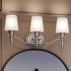 An Urban Ambiance bathroom vanity with a unique mirror.