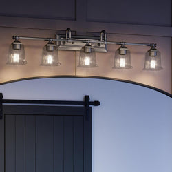 A unique bathroom light fixture with a barn door.