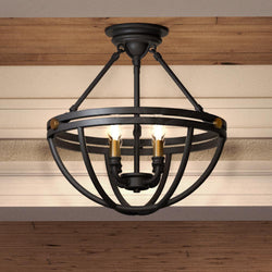 The Urban Ambiance UQL4240 Bridgend Collection modern farmhouse ceiling light features an estate bronze finish, sculptural open spherical cage, and three exposed bulbs. Measures 14''H x 15.75''W.
