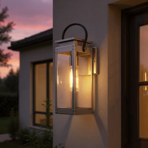 The Urban Ambiance UHP1131 Modern Farmhouse Outdoor Wall Light from the Darwin Collection features a stainless steel finish and rectangular design, showcasing a visible bulb and stylishly mounted on your home's exterior wall.