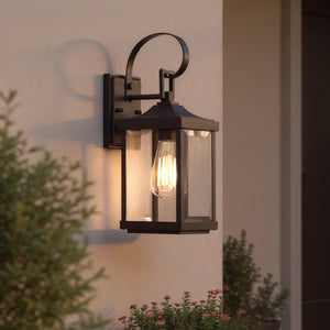 The Urban Ambiance UHP1402 Calderdale 15.125''H x 5.5''W outdoor wall sconce, in midnight black, showcases beveled glass panels and adds a warm glow to outdoor spaces with its transitional design.