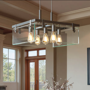 The UHP2445 Modern Farmhouse Square Chandelier by Urban Ambiance (Bristol Collection, 13-3/4"H x 22-3/4"W, brushed nickel) hangs from the ceiling in a room with large windows and neutral walls.