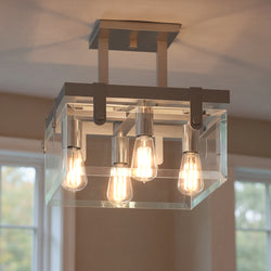 The Urban Ambiance UHP2449 Modern Farmhouse Square Ceiling Fixture from the Bristol Collection features a brushed nickel finish and exposed bulbs, adding style to your beige ceiling. Measures 14"H x 16-3/4"W SQ.